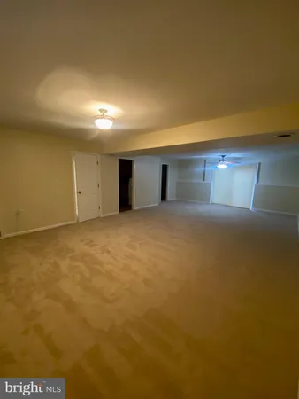 a bathroom with a sink a toilet a mirror a vanity and shower