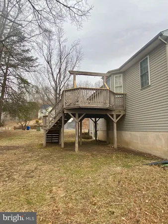 a view of a yard with a table and chairs