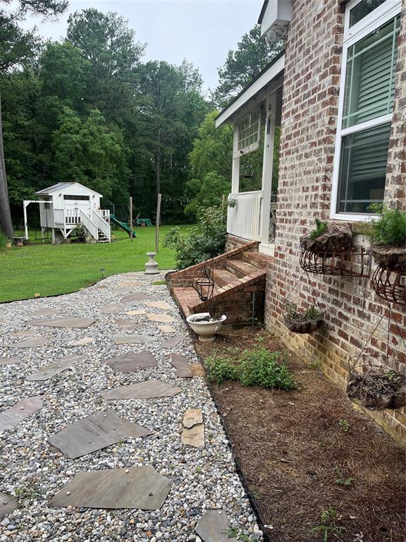2080 Highway 162 Benton, LA 71006 - Photo 11 of 19 a view of a house with backyard and garden