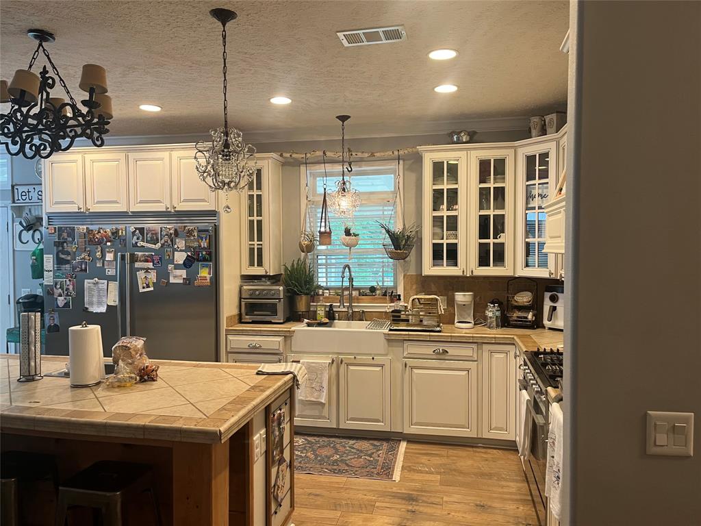 2080 Highway 162 Benton, LA 71006 - Photo 18 of 19 a kitchen with lots of counter top space and wooden floor