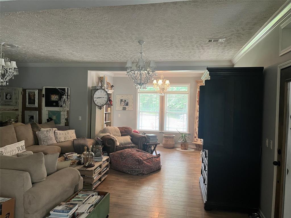 2080 Highway 162 Benton, LA 71006 - Photo 3 of 19 a living room with furniture and a chandelier