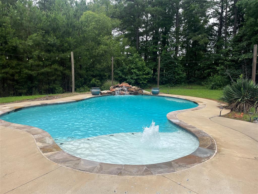2080 Highway 162 Benton, LA 71006 - Photo 8 of 19 a view of a swimming pool with a yard