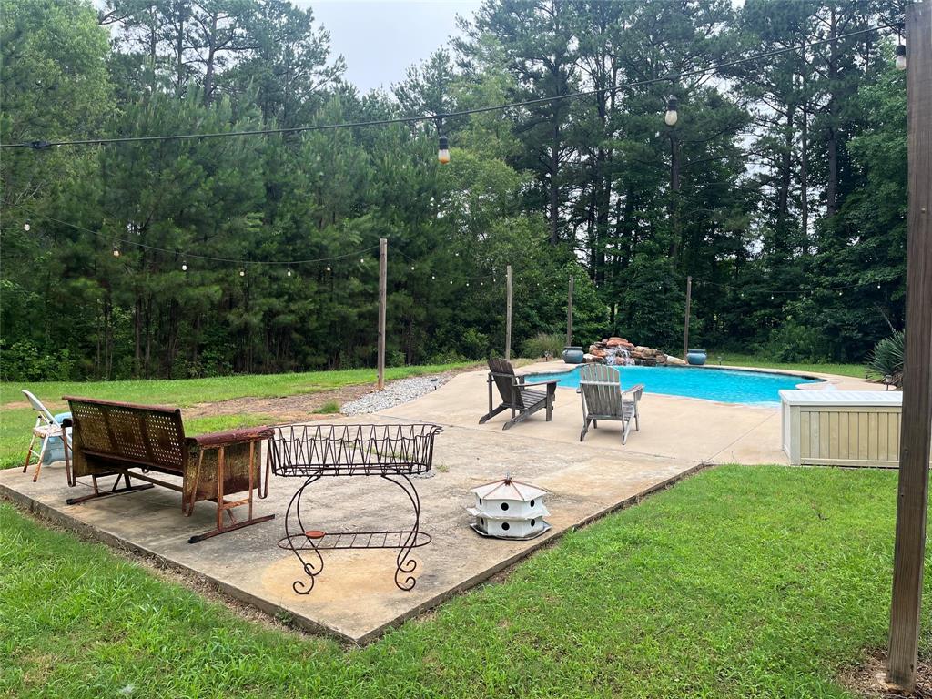 2080 Highway 162 Benton, LA 71006 - Photo 9 of 19 a view of a swimming pool with a patio