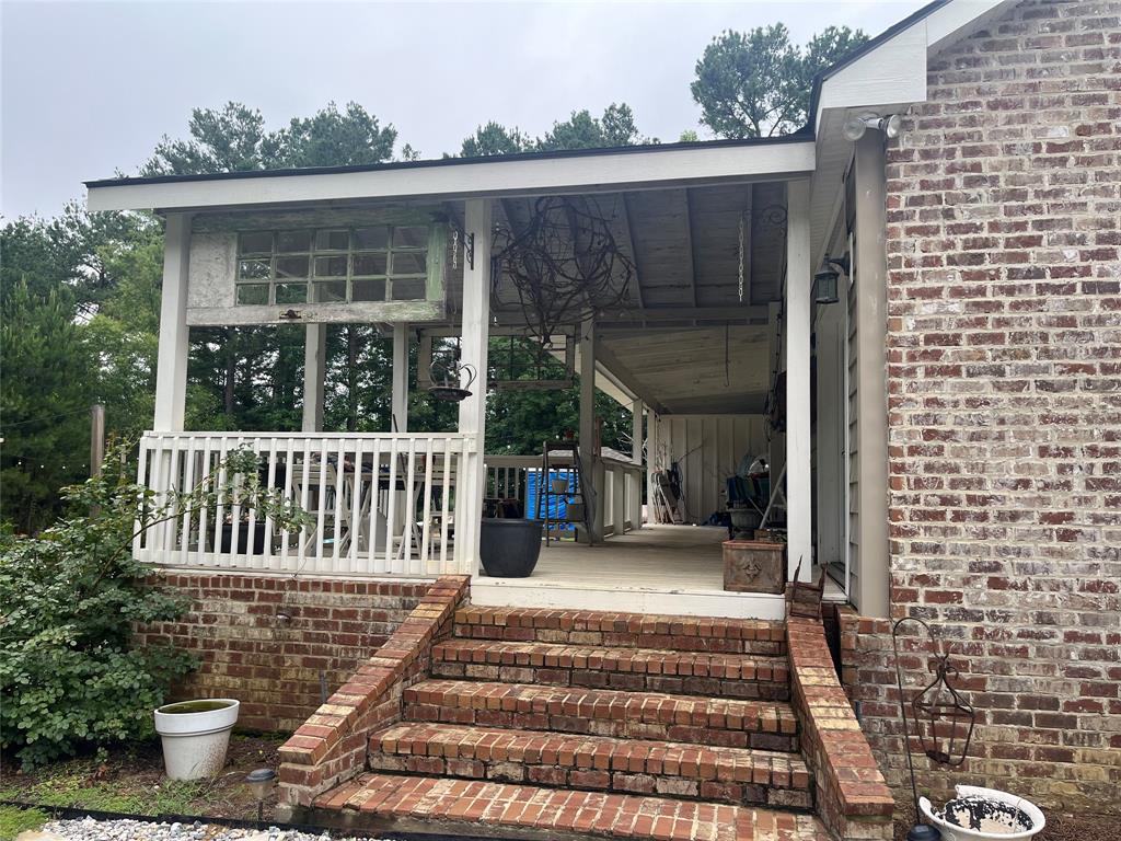 2080 Highway 162 Benton, LA 71006 - Photo 10 of 19 a view of a house with a small yard and wooden fence