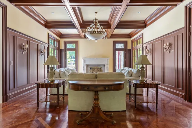 a view of a dining room with furniture wooden floor and chandelier