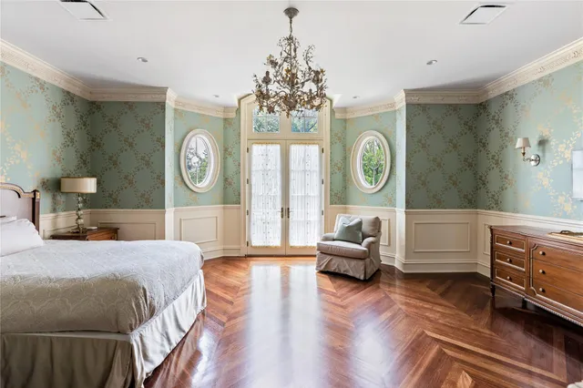a living room with furniture a clock and a window