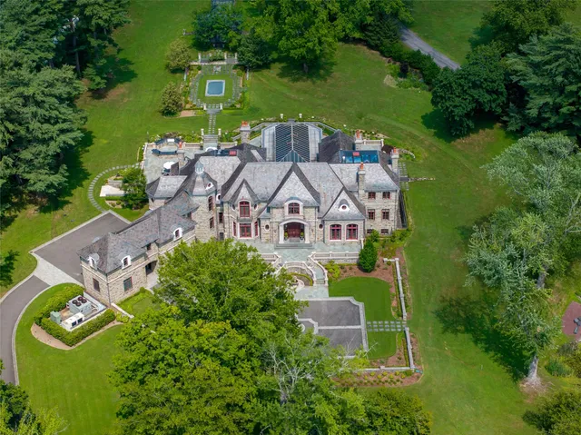 an aerial view of a house with a garden