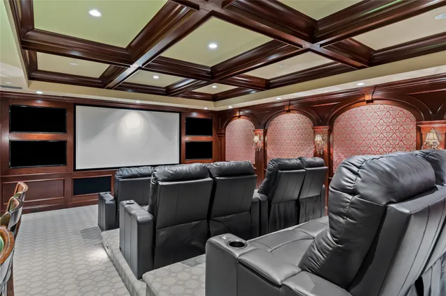 a media room with lots of chairs and a projector screen