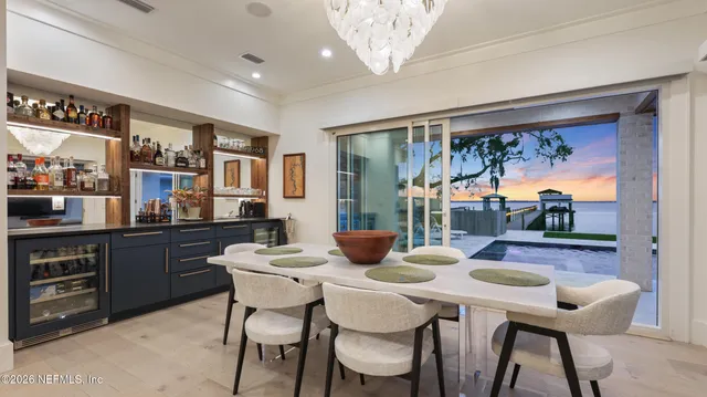 a living room with furniture potted plant and a window