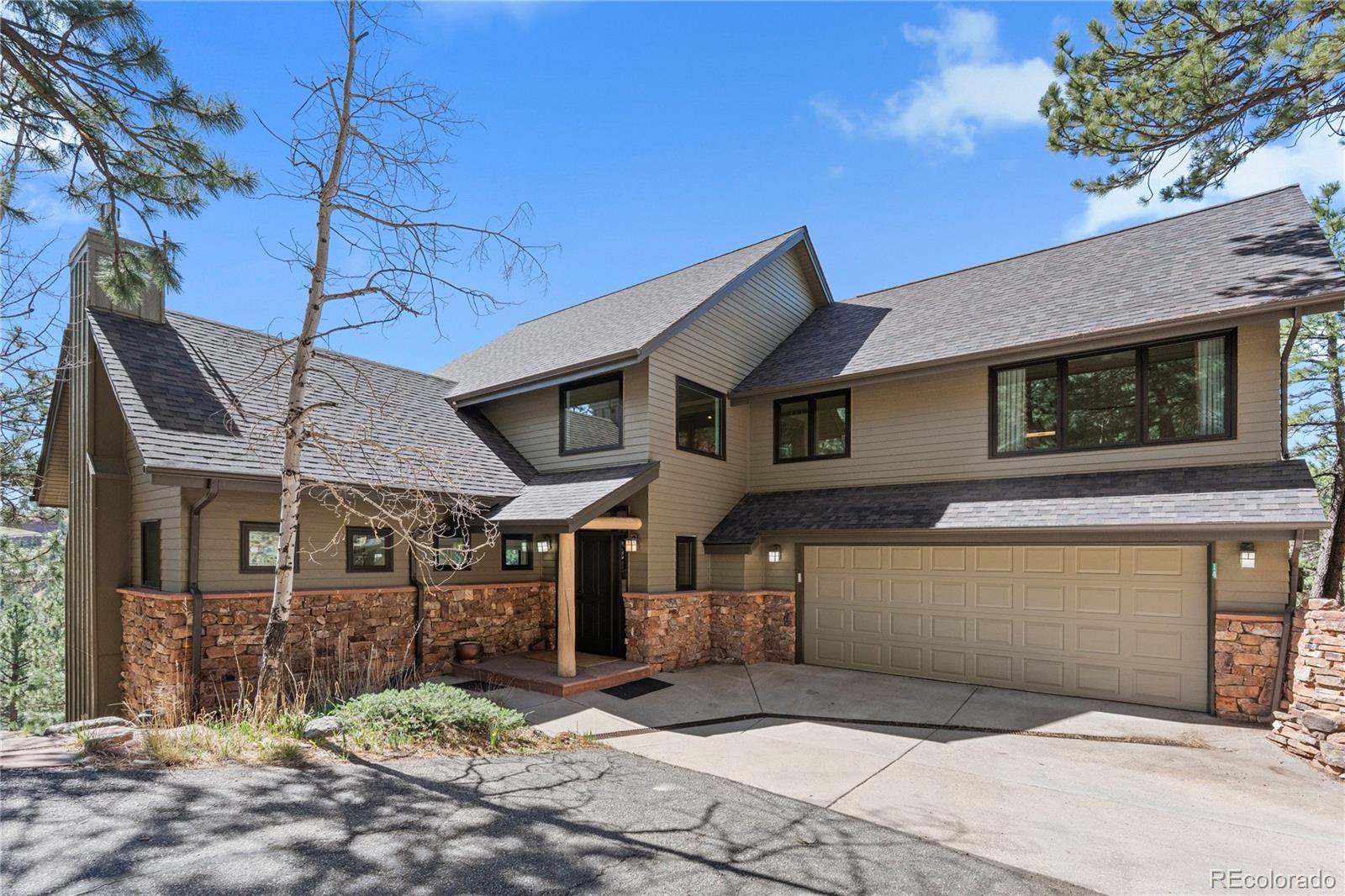 14 Pine Brook Road Boulder, CO 80304 - Photo 1 of 49 a front view of a house with garden