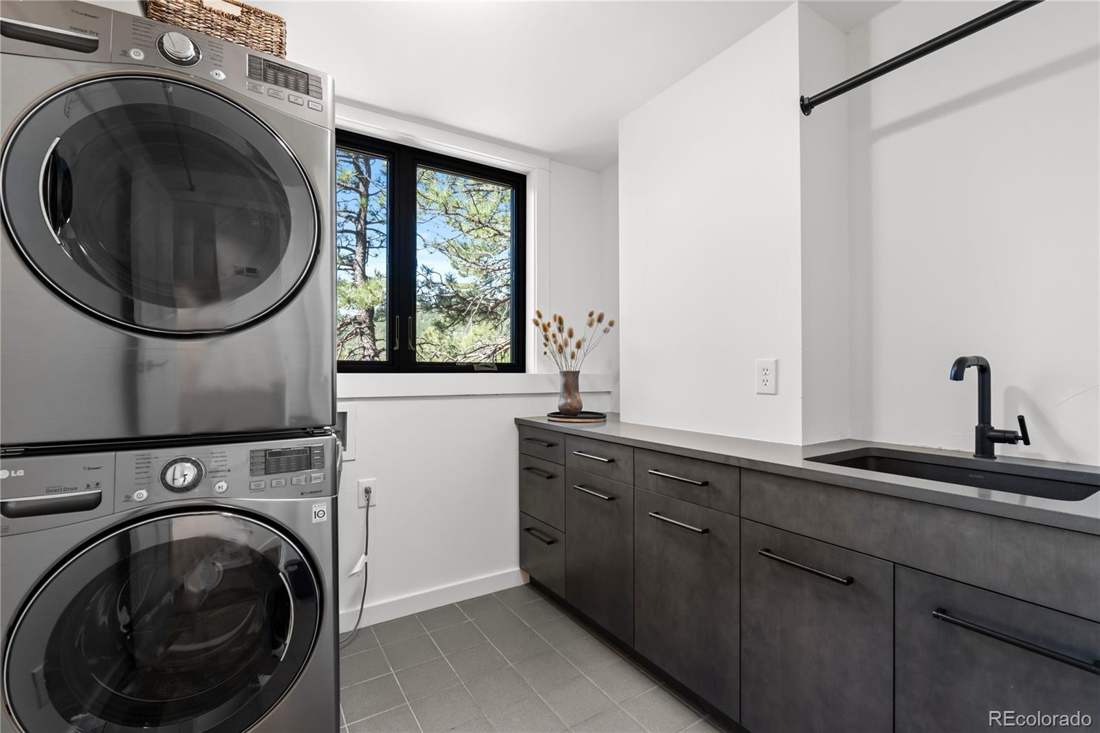 14 Pine Brook Road Boulder, CO 80304 - Photo 18 of 49 a utility room with sink dryer and washer