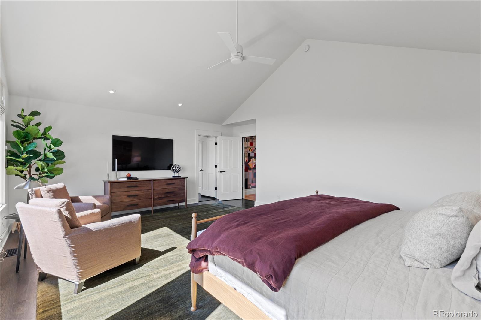 14 Pine Brook Road Boulder, CO 80304 - Photo 26 of 49 a bedroom with a bed and a flat screen tv