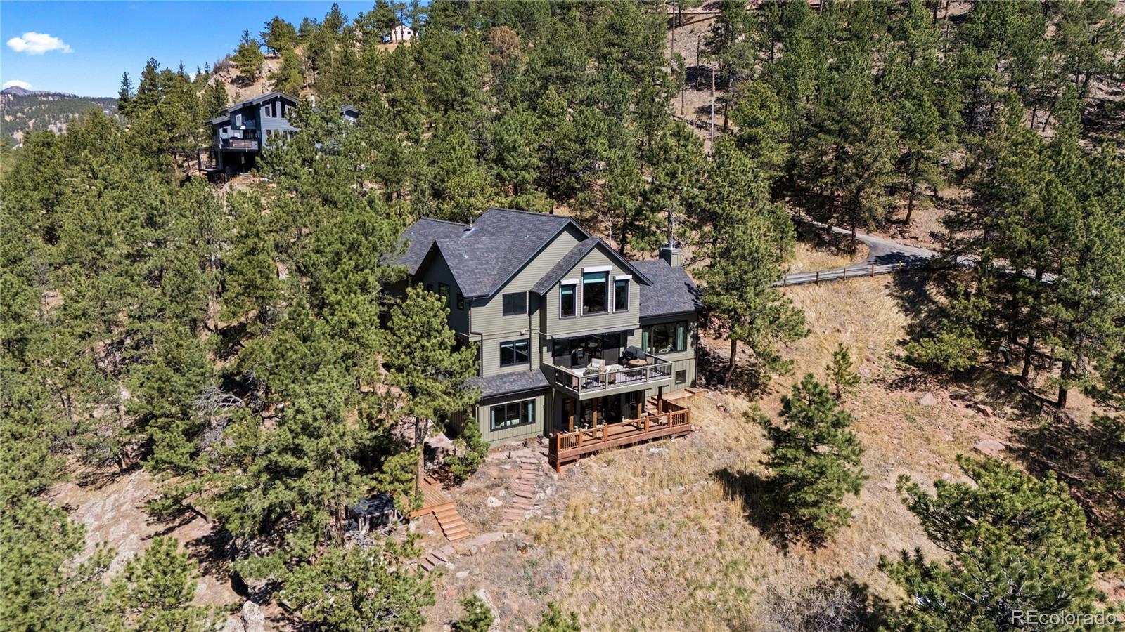 14 Pine Brook Road Boulder, CO 80304 - Photo 4 of 49 an aerial view of a house with yard outdoor seating and trees