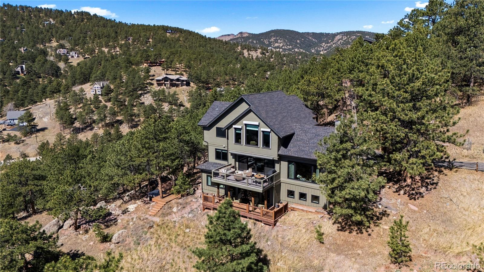 14 Pine Brook Road Boulder, CO 80304 - Photo 44 of 49 an aerial view of house with yard and mountain view in back