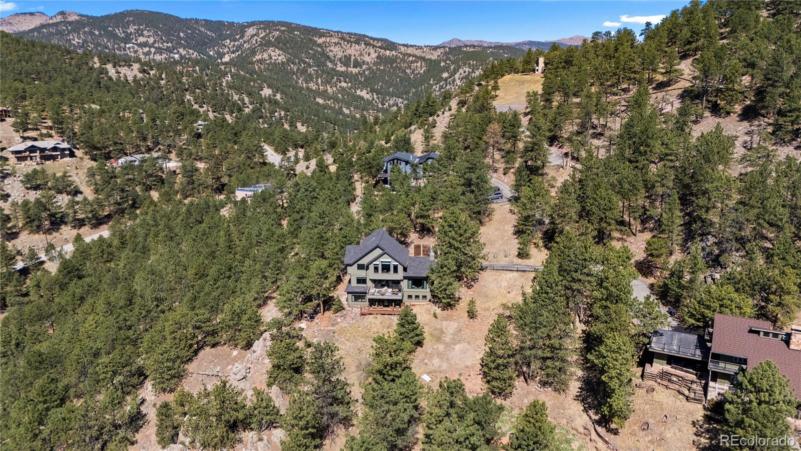 14 Pine Brook Road Boulder, CO 80304 - Photo 47 of 49 an aerial view of residential house with yard and mountain view in back