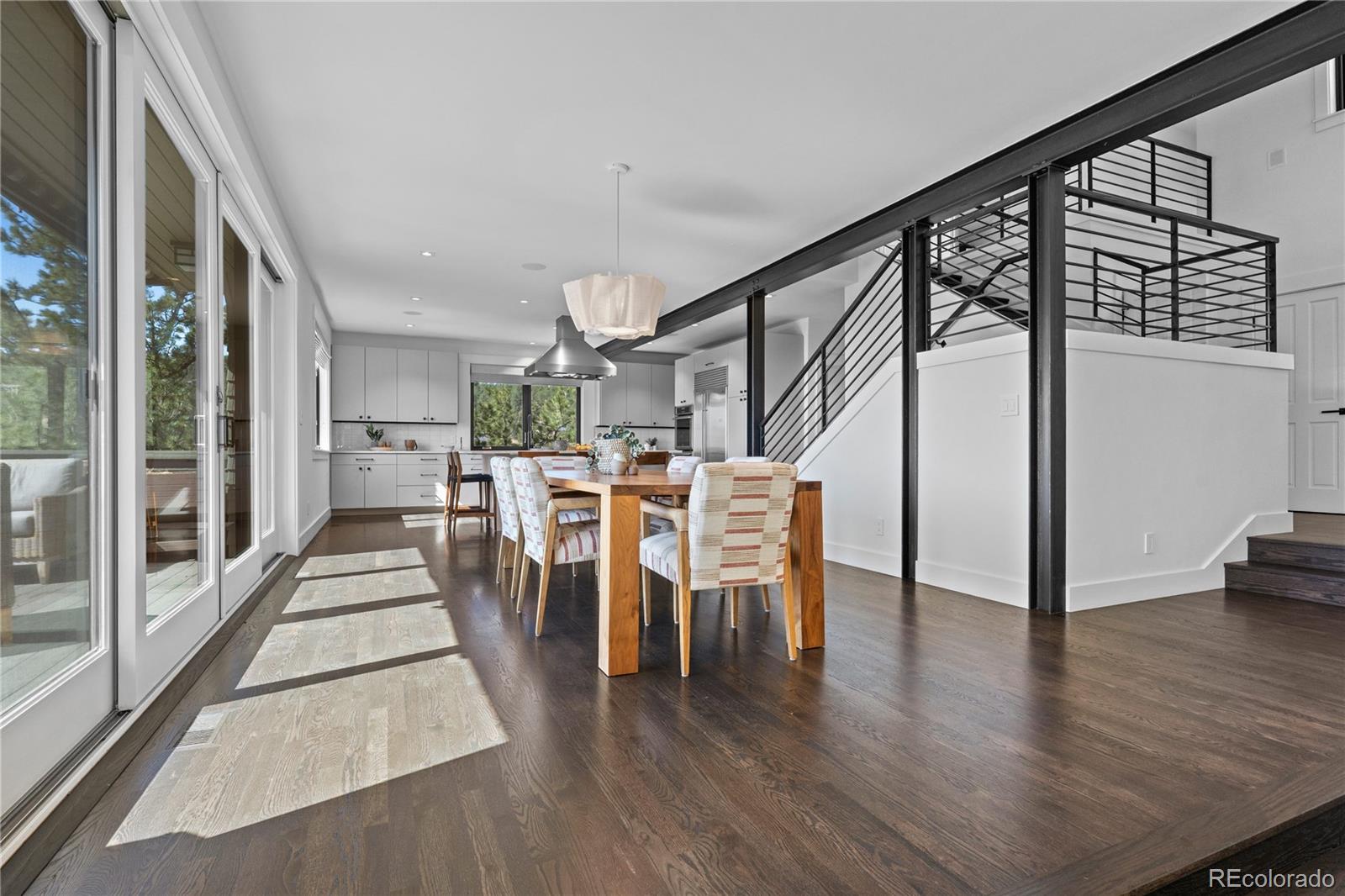 14 Pine Brook Road Boulder, CO 80304 - Photo 9 of 49 a view of a hallway with wooden floor table and chairs