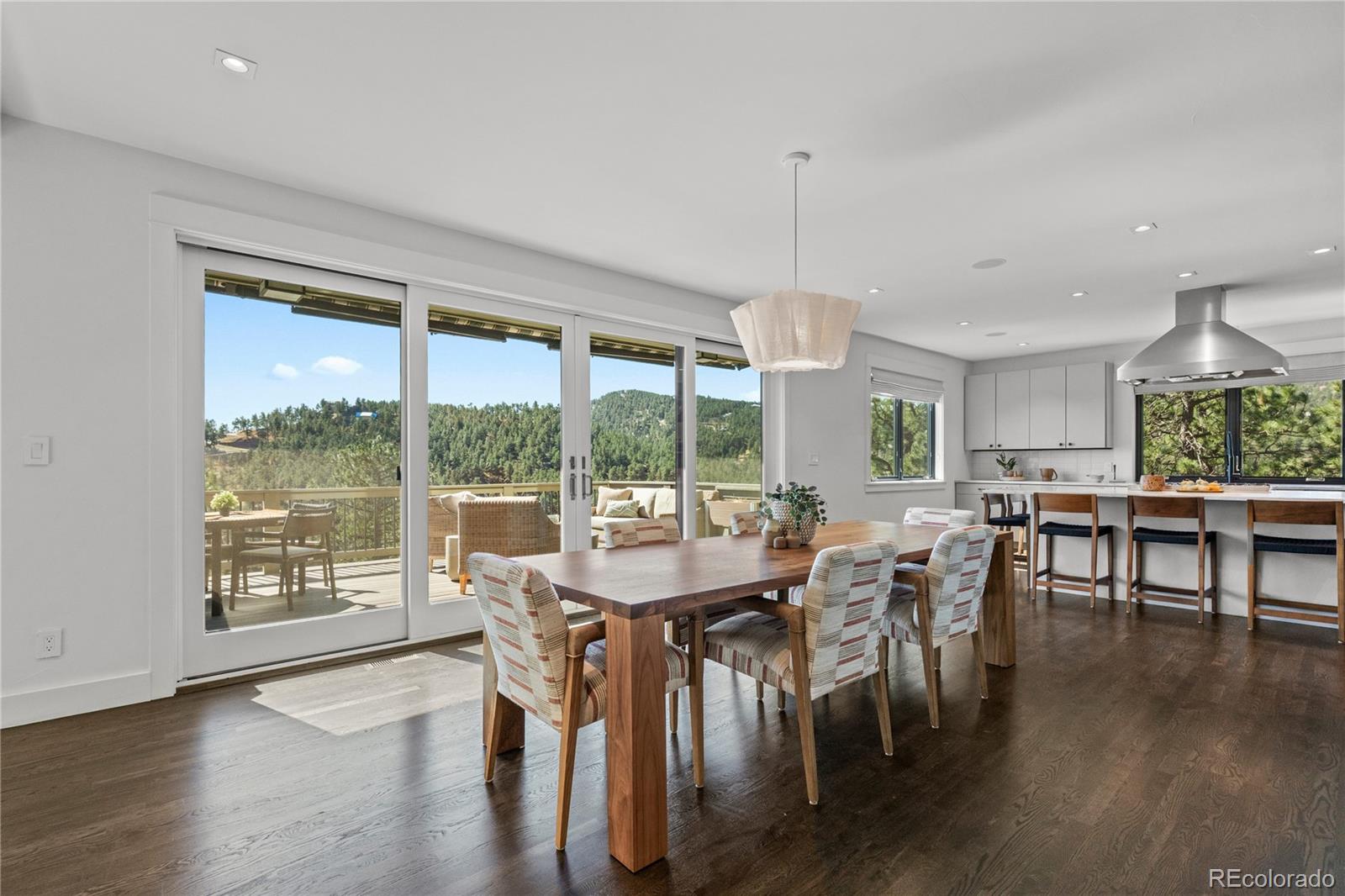 14 Pine Brook Road Boulder, CO 80304 - Photo 10 of 49 a view of a dining room with furniture window and wooden floor