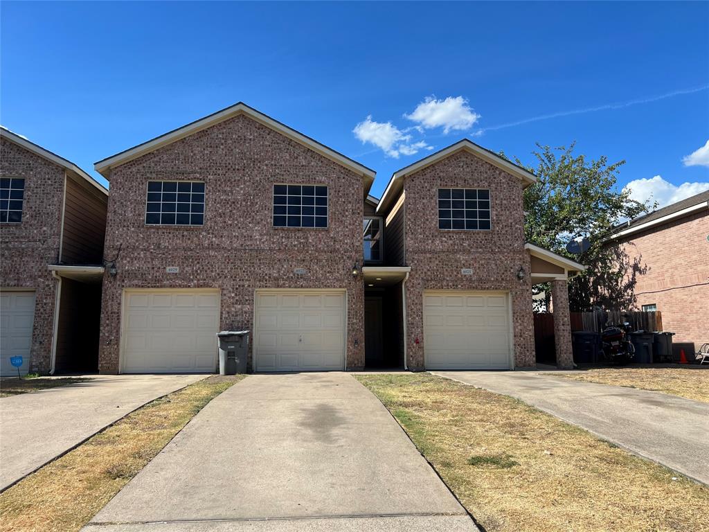 4027 Preferred Place Dallas, TX 75237 - Photo 1 of 27 a front view of a house with a yard