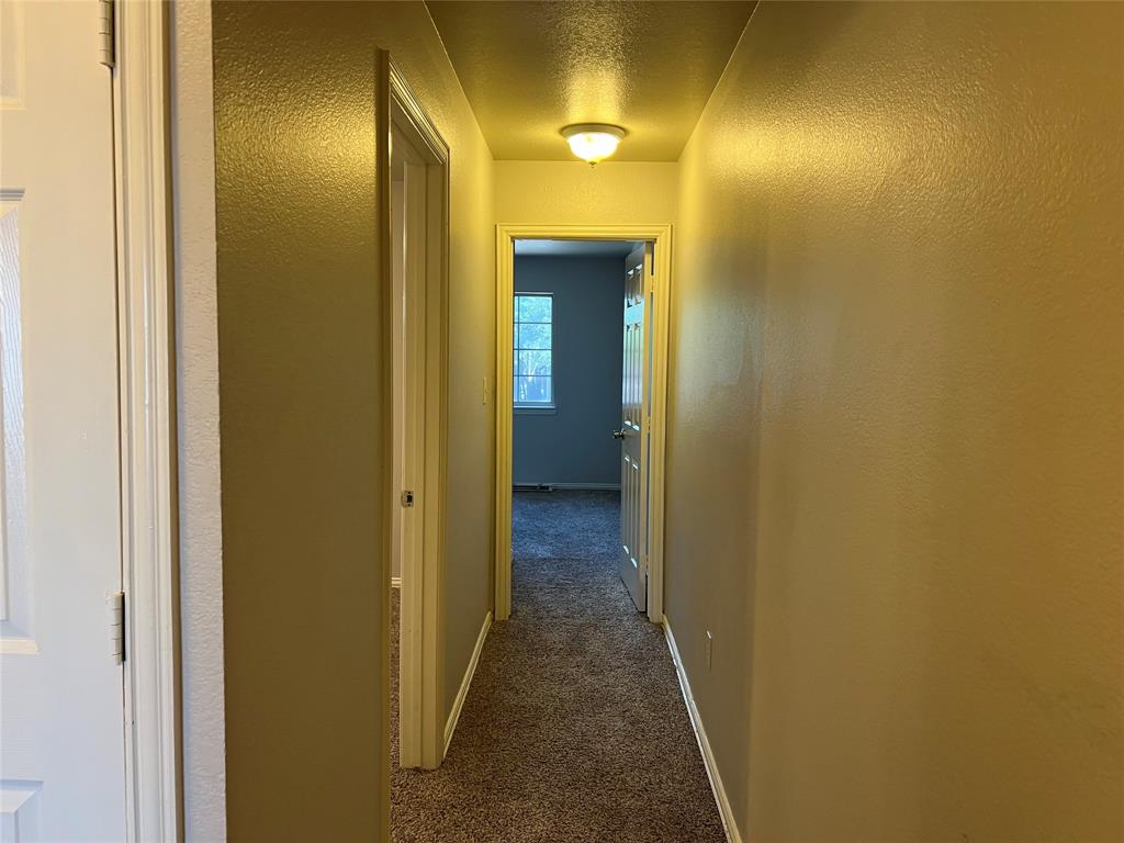 4027 Preferred Place Dallas, TX 75237 - Photo 14 of 27 a view of a hallway with wooden floor