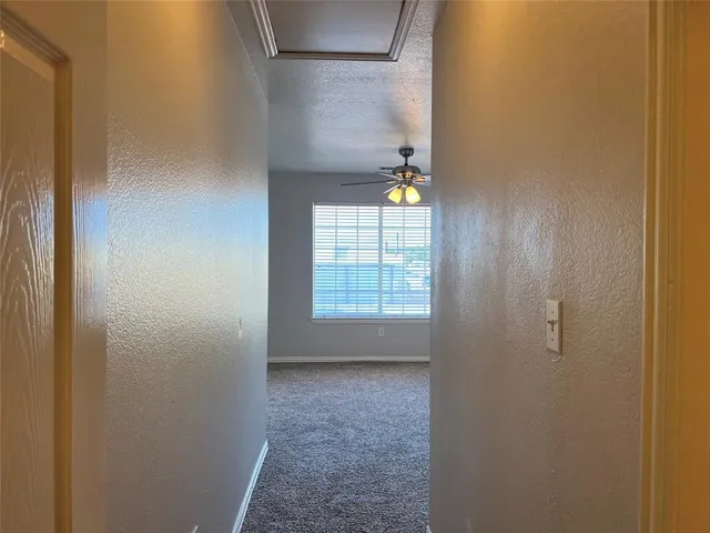 a white toilet sitting next to a bath tub