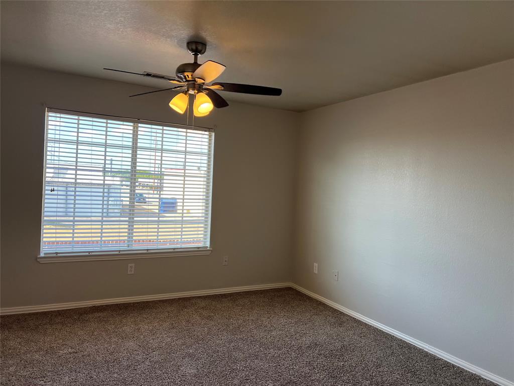 4027 Preferred Place Dallas, TX 75237 - Photo 22 of 27 a view of an empty room with window and dresser