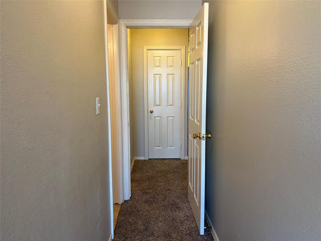4027 Preferred Place Dallas, TX 75237 - Photo 25 of 27 a view of a hallway with wooden floor