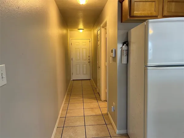 a bathroom with a shower and a mirror