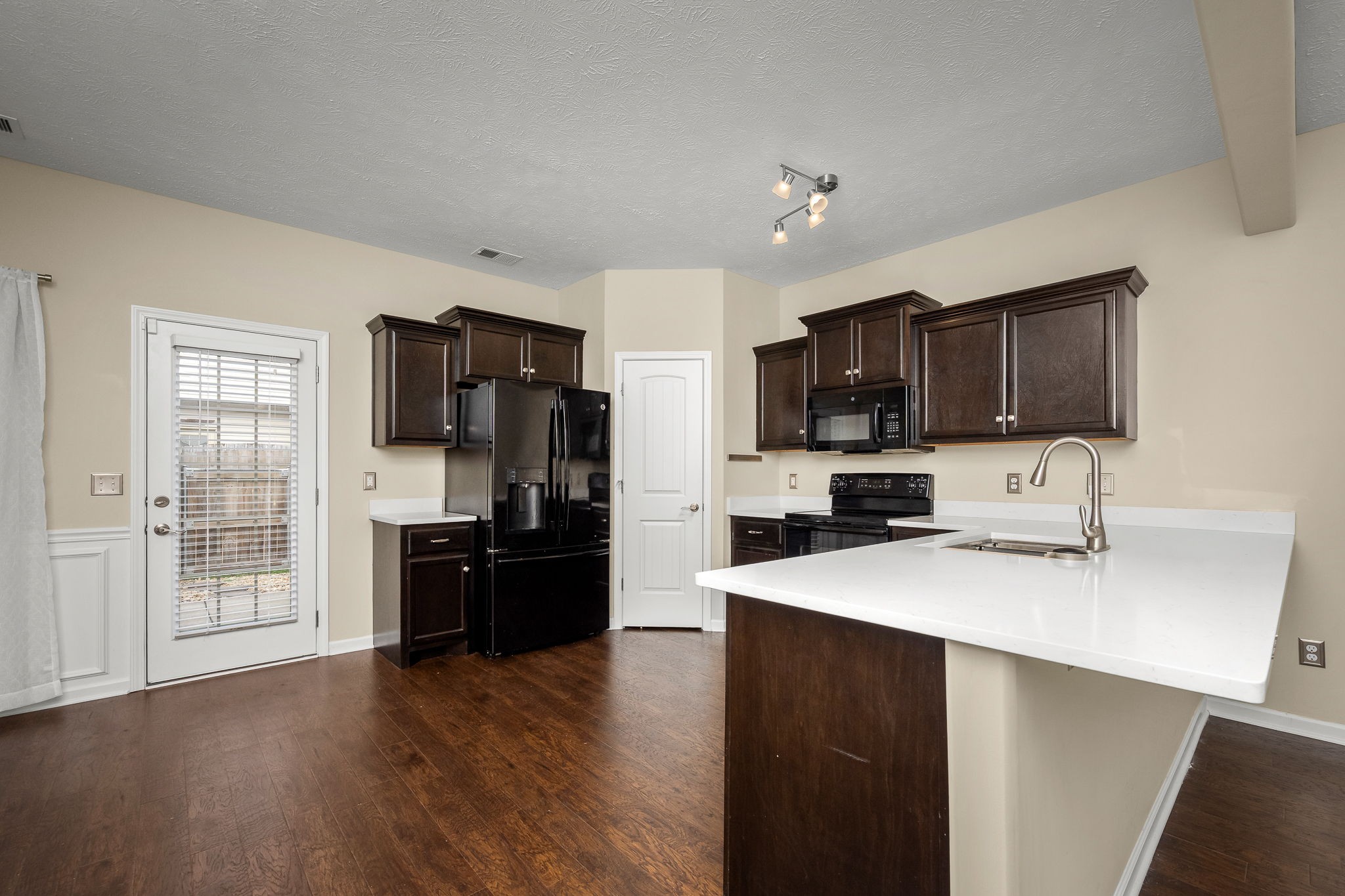 5322 Dan Post Way Murfreesboro, TN 37128 - Photo 16 of 39 a kitchen with a refrigerator and a stove top oven