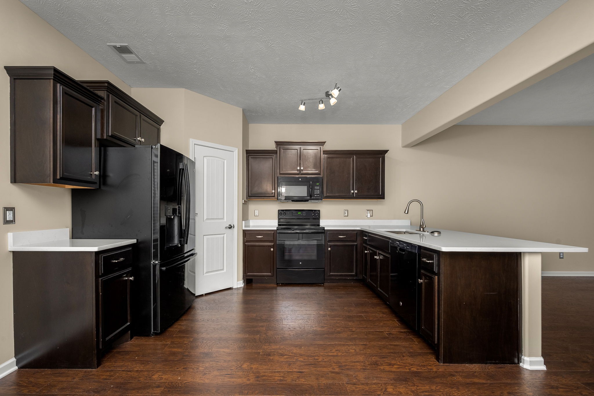 5322 Dan Post Way Murfreesboro, TN 37128 - Photo 17 of 39 a large kitchen with stainless steel appliances kitchen island granite countertop a stove refrigerator and cabinets