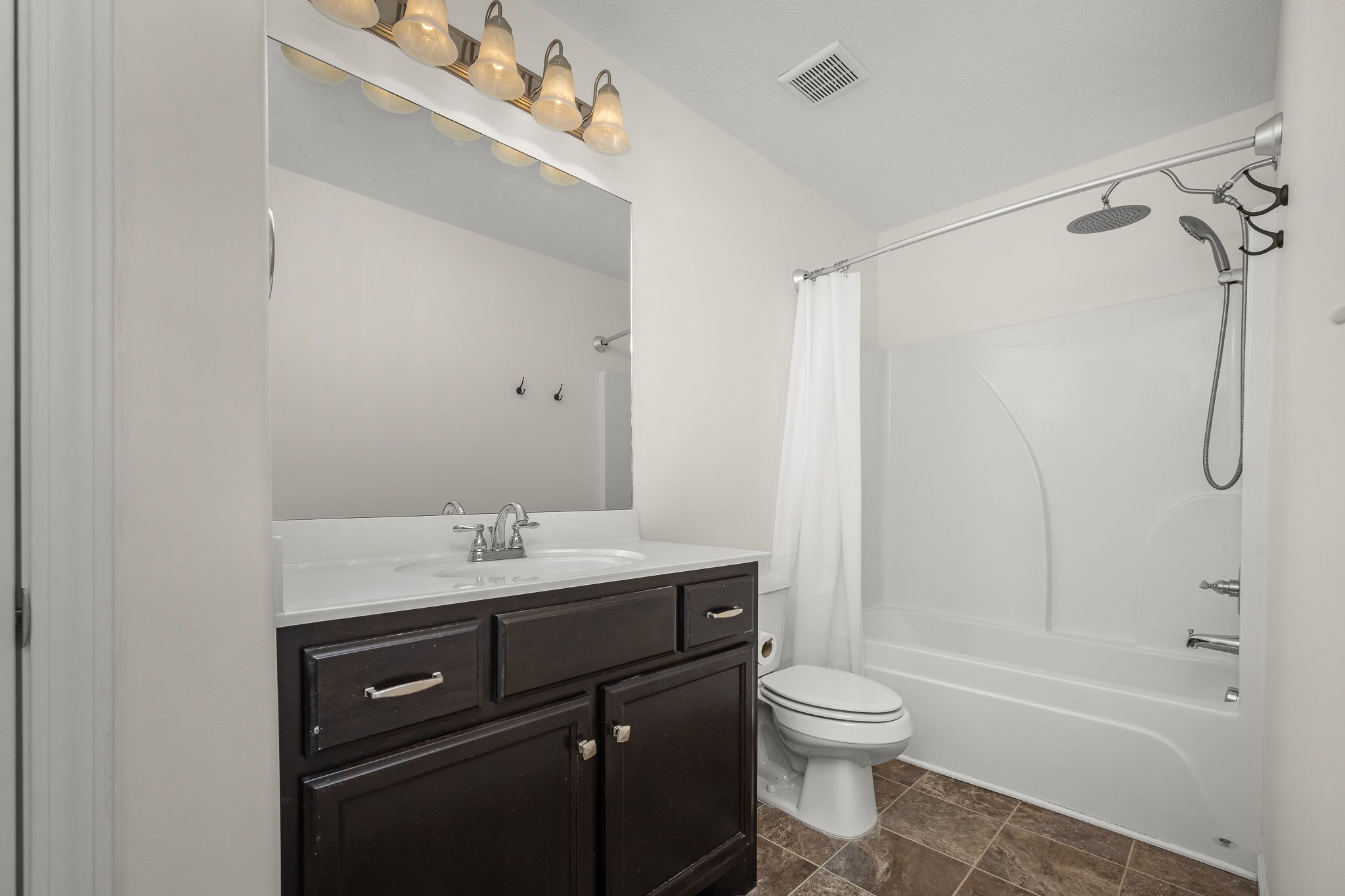 5322 Dan Post Way Murfreesboro, TN 37128 - Photo 27 of 39 a bathroom with a granite countertop sink toilet a shower and a mirror