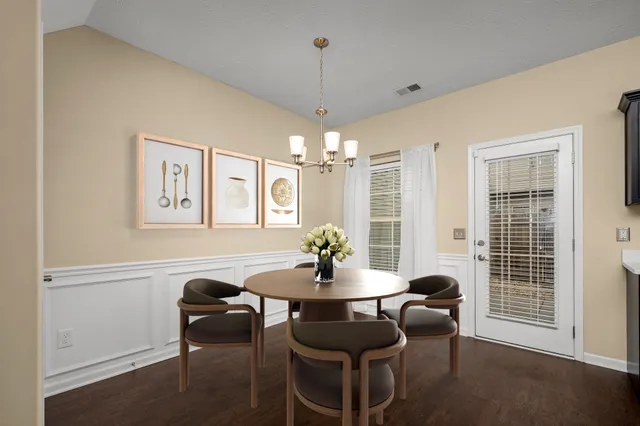 a dining room with furniture and window