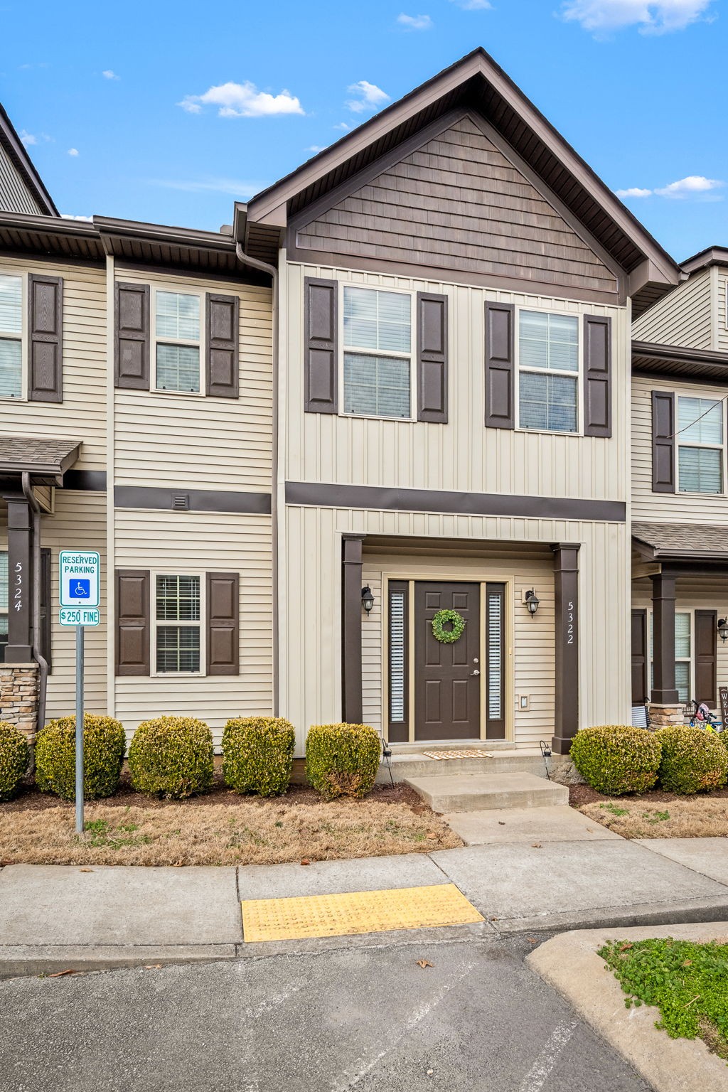 5322 Dan Post Way Murfreesboro, TN 37128 - Photo 5 of 39 a front view of a house with a yard and garage