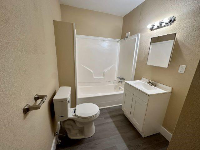 1423 East Elm Street Tyler, TX 75702 - Photo 12 of 15 a bathroom with a sink toilet and shower