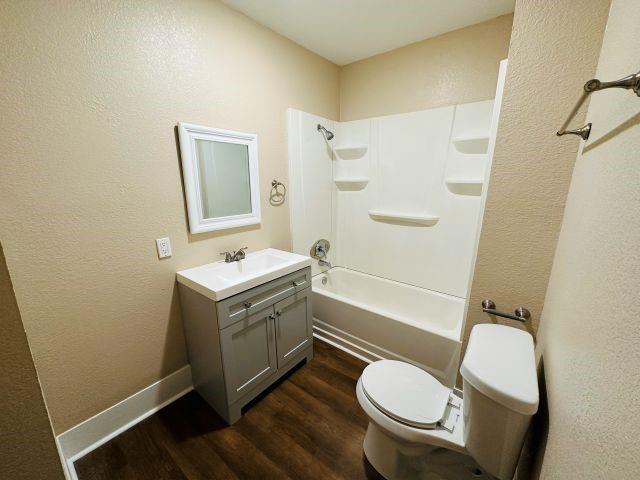 1423 East Elm Street Tyler, TX 75702 - Photo 13 of 15 a bathroom with a sink toilet and shower