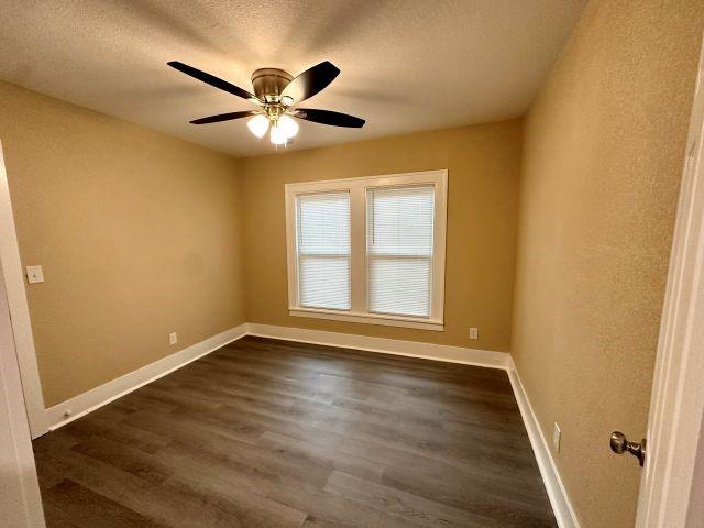1423 East Elm Street Tyler, TX 75702 - Photo 8 of 15 a view of an empty room with wooden floor and a window