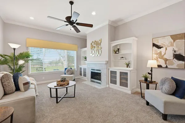 a living room with furniture and a fireplace