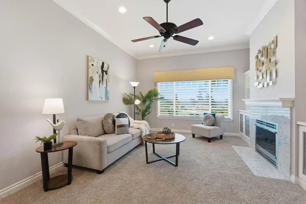 a living room with furniture and a large window