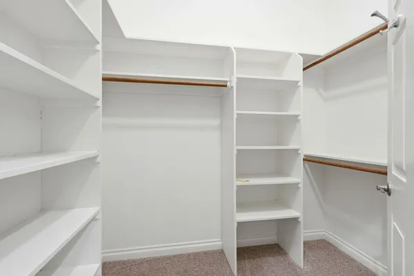 a view of an empty walk in closet
