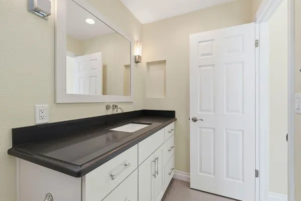 a kitchen with a sink and cabinets
