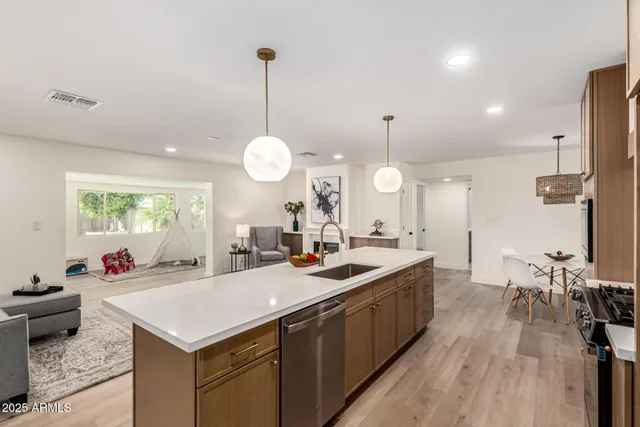 a kitchen with sink stove and cabinets