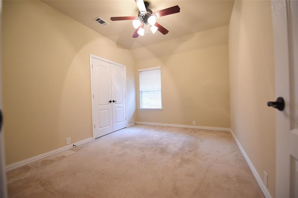 855 Llano Drive Allen, TX 75013 - Photo 13 of 20 an empty room with windows and fan