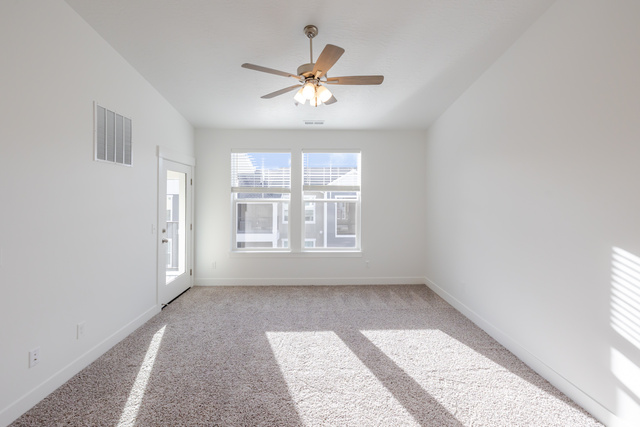 4662 Poplar Way, Unit Q302 Mapleton, UT 84664 - Photo 14 of 17 Unfurnished room with ceiling fan and light colored carpet