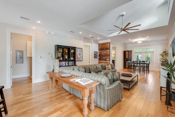 a living room with furniture and wooden floor