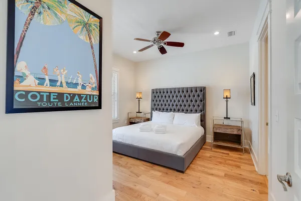 a bedroom with a large bed and a window