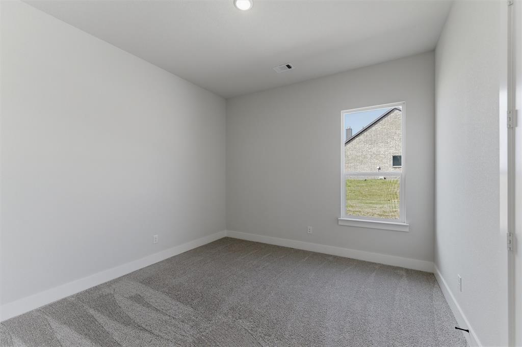 814 Vly Rdg Road Van Alstyne, TX 75495 - Photo 15 of 24 an empty room with a window