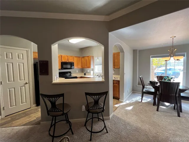 a dining room with furniture and window