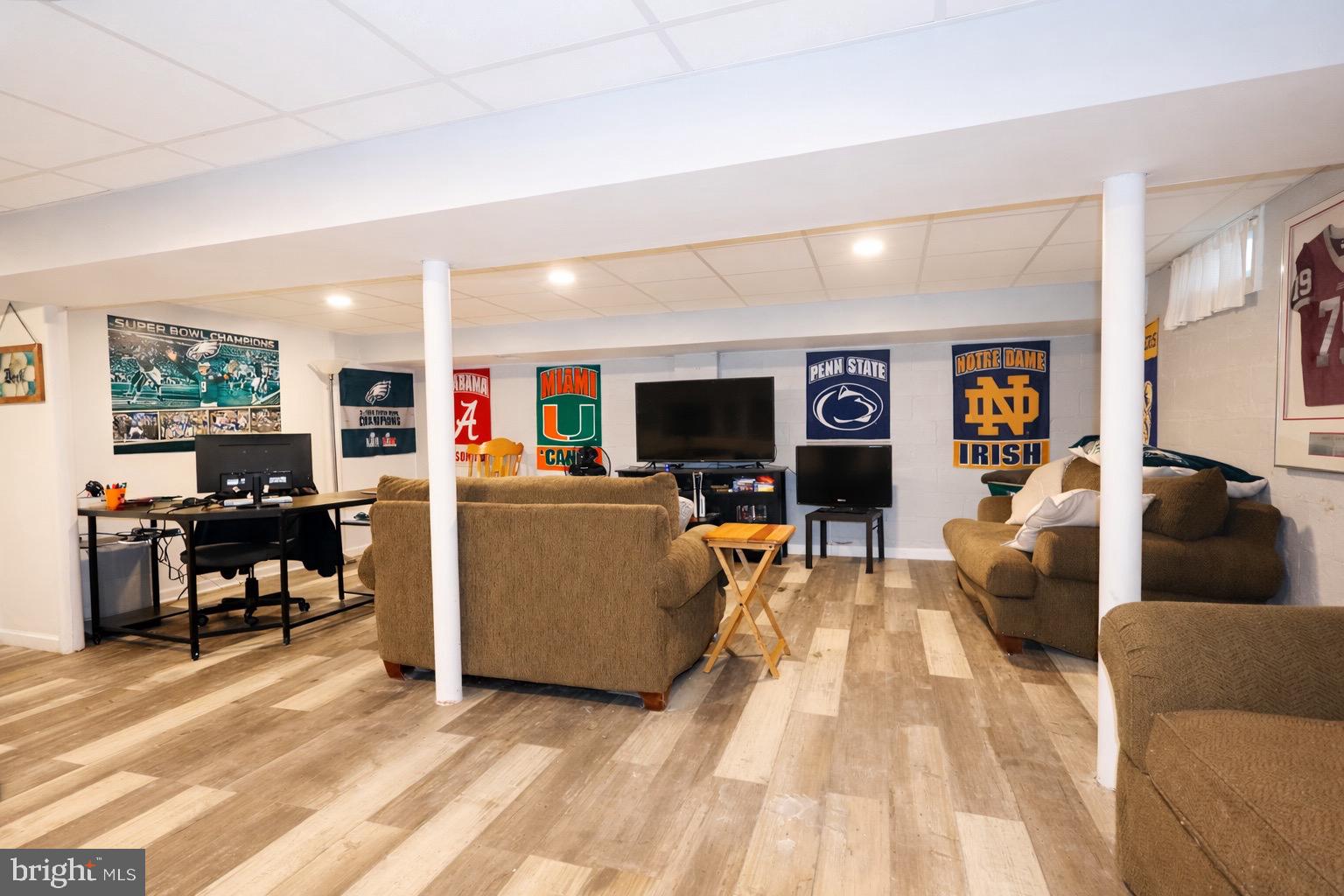 418 Perkins Lane Delanco, NJ 08075 - Photo 14 of 17 Cozy basement retreat with sports flair.