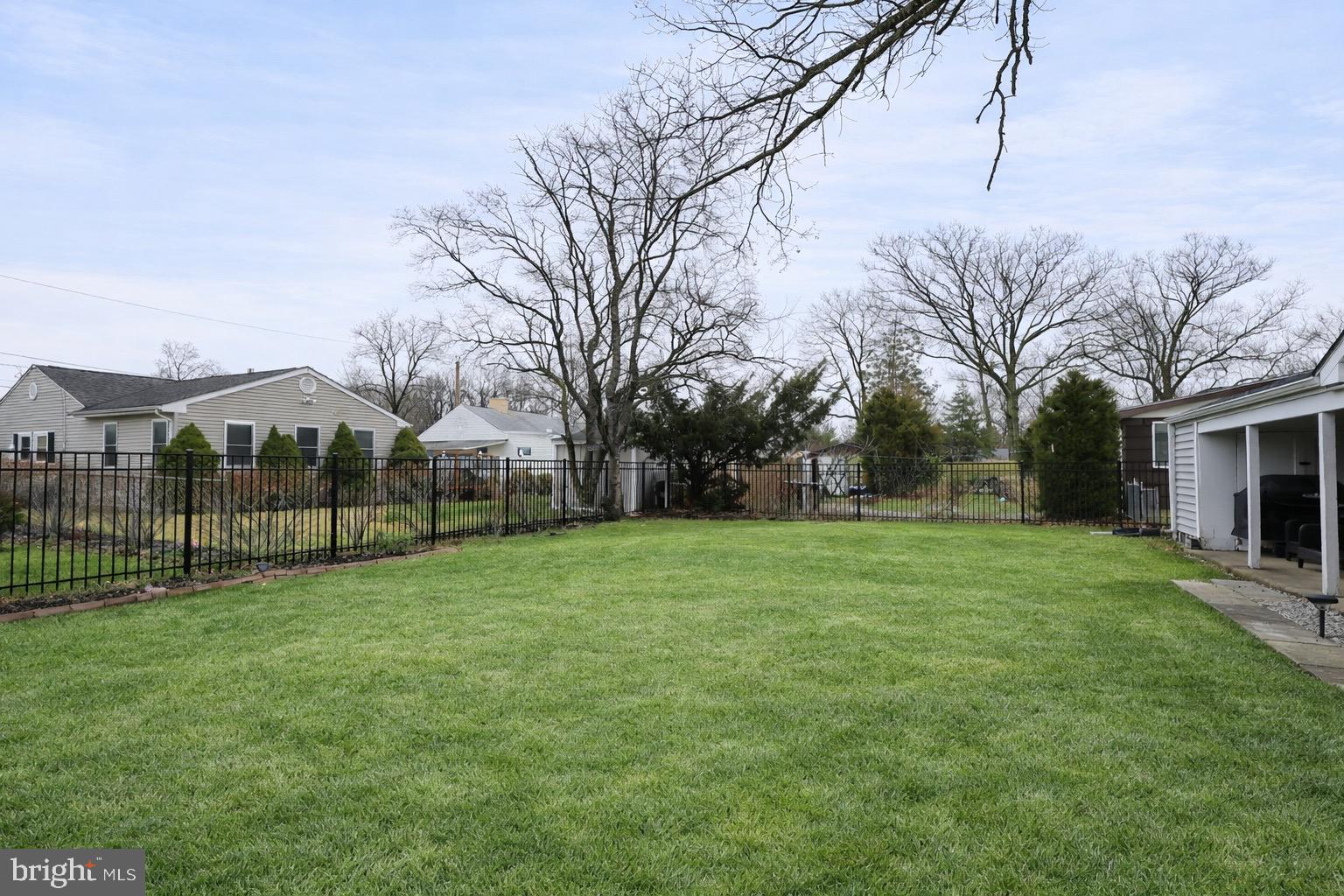 418 Perkins Lane Delanco, NJ 08075 - Photo 17 of 17 Spacious green yard with serene surroundings.