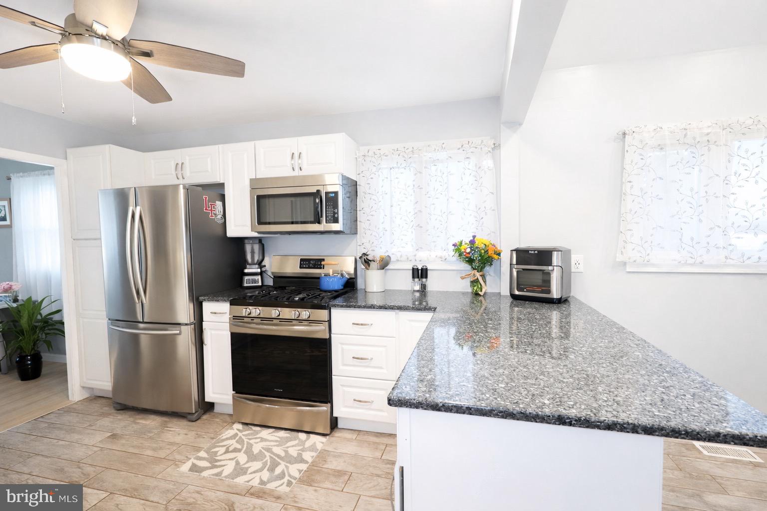 418 Perkins Lane Delanco, NJ 08075 - Photo 4 of 17 Modern kitchen with sleek finishes.