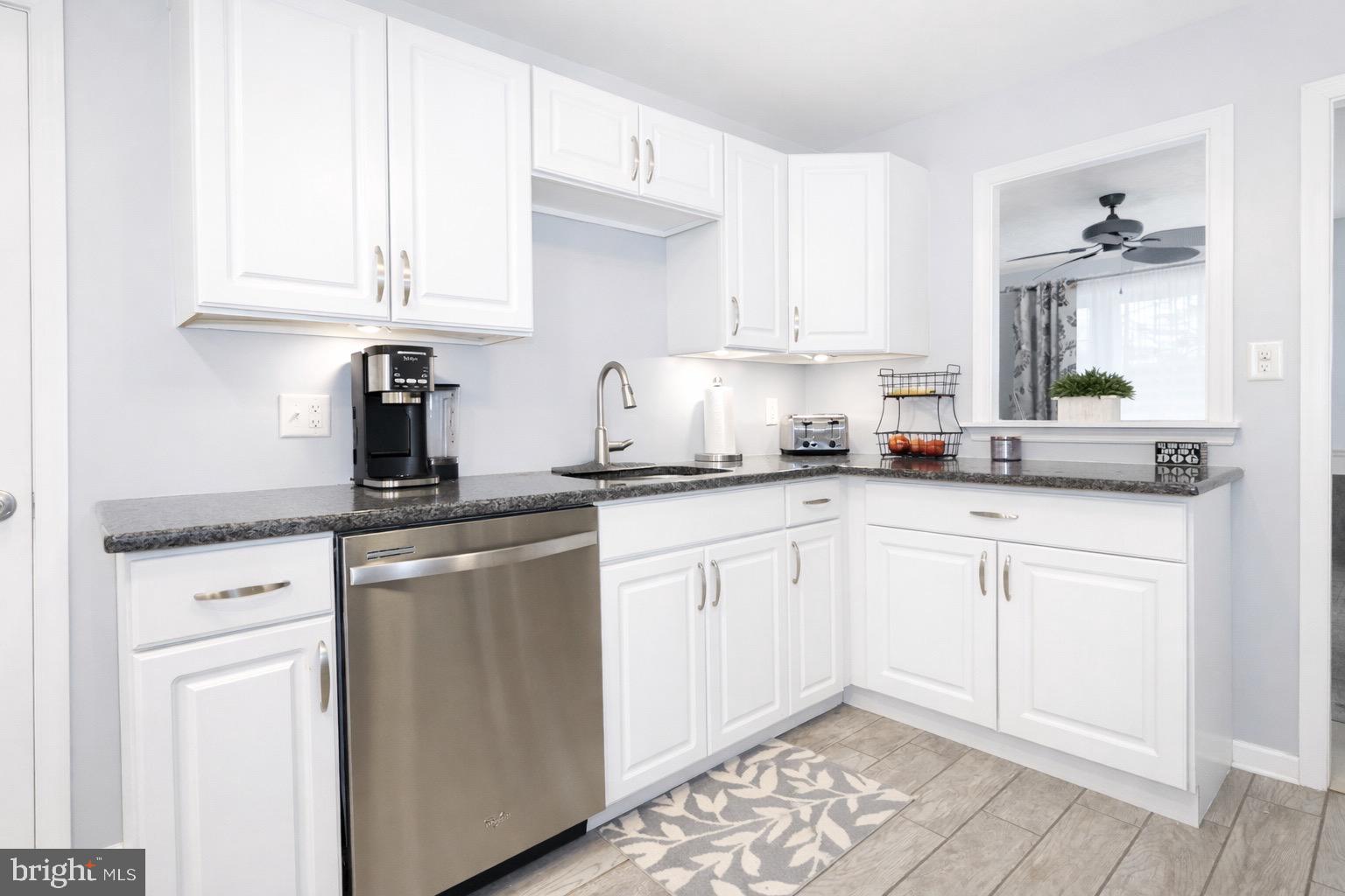 418 Perkins Lane Delanco, NJ 08075 - Photo 5 of 17 Modern kitchen with sleek white cabinetry.